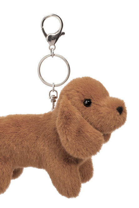 Brown dog-shaped keychain on a white background