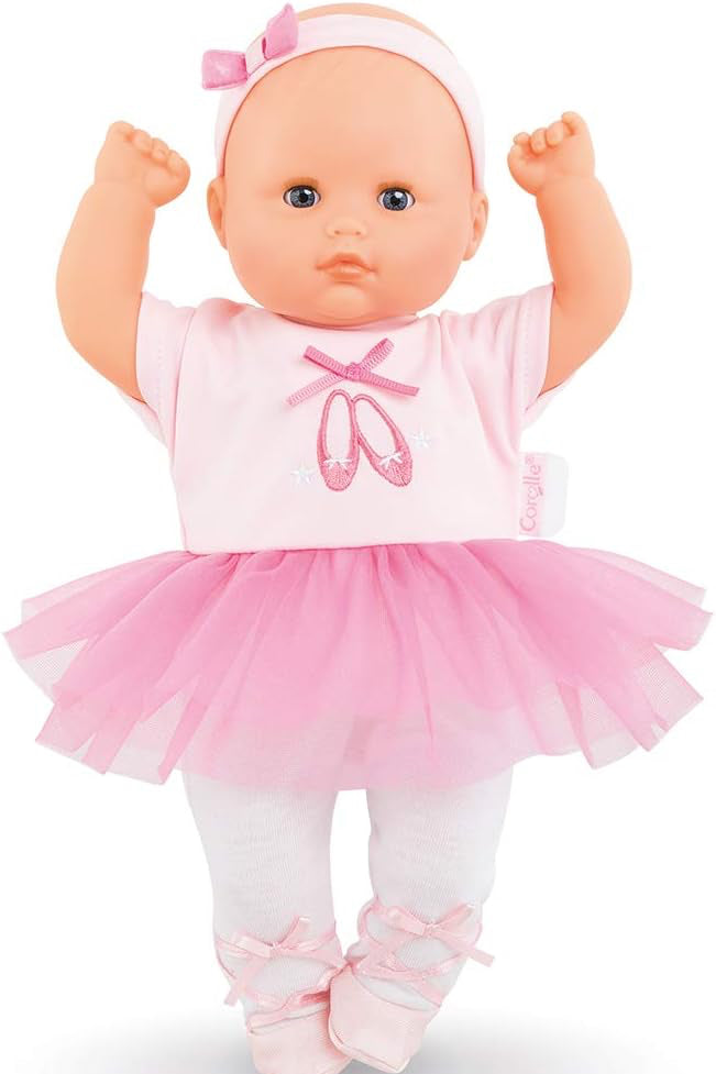Doll in a pink ballet outfit with tutu and shoes on a white background