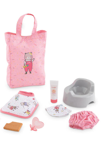 Collection of baby care items including a pink bag, bottle, bib, and other accessories on a white background.