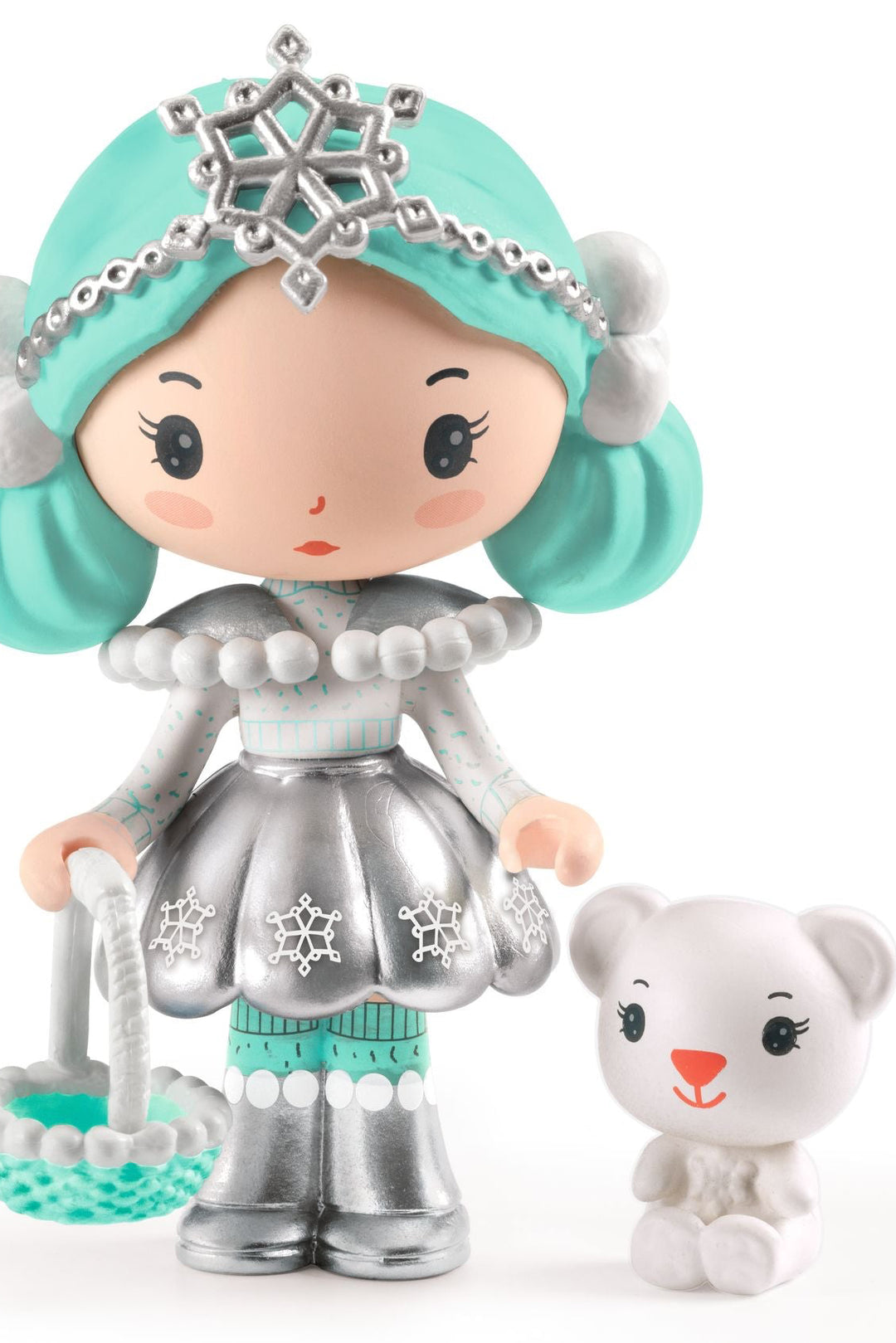 Toy figure of a girl with turquoise hair and silver outfit holding a small white dog on a white background