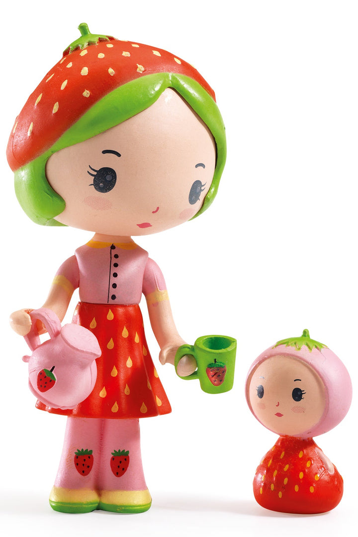 Strawberry doll and pitcher with cup and baby on white background