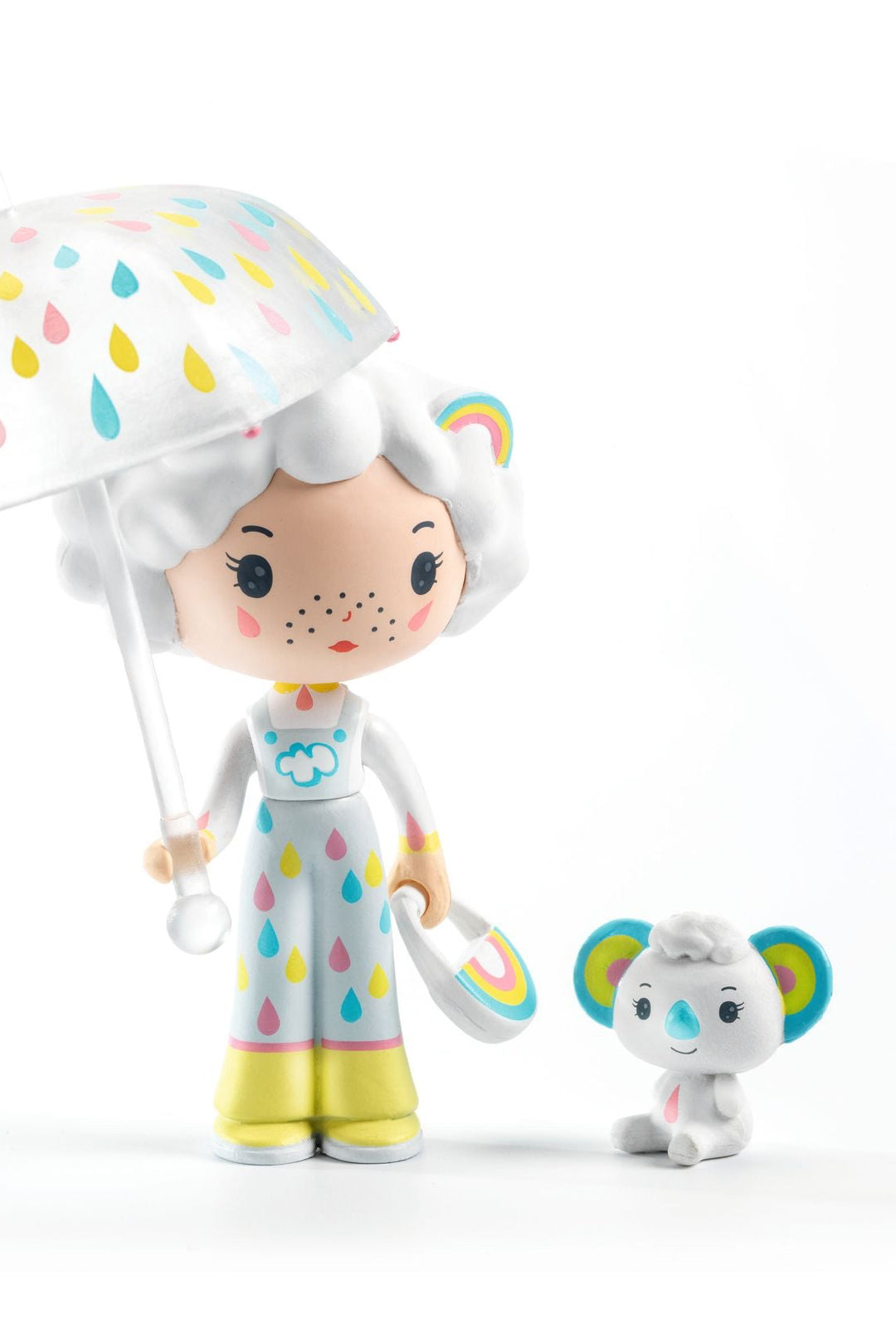 Toy figure with colorful umbrella and matching toy on a white background