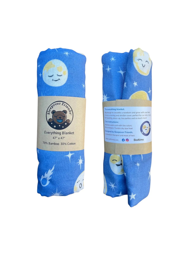 Two rolled-up blue blankets with cartoon designs on a white background