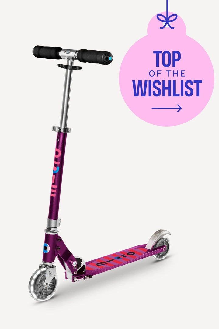 Purple scooter with 'Top of the Wishlist' text on a white background
