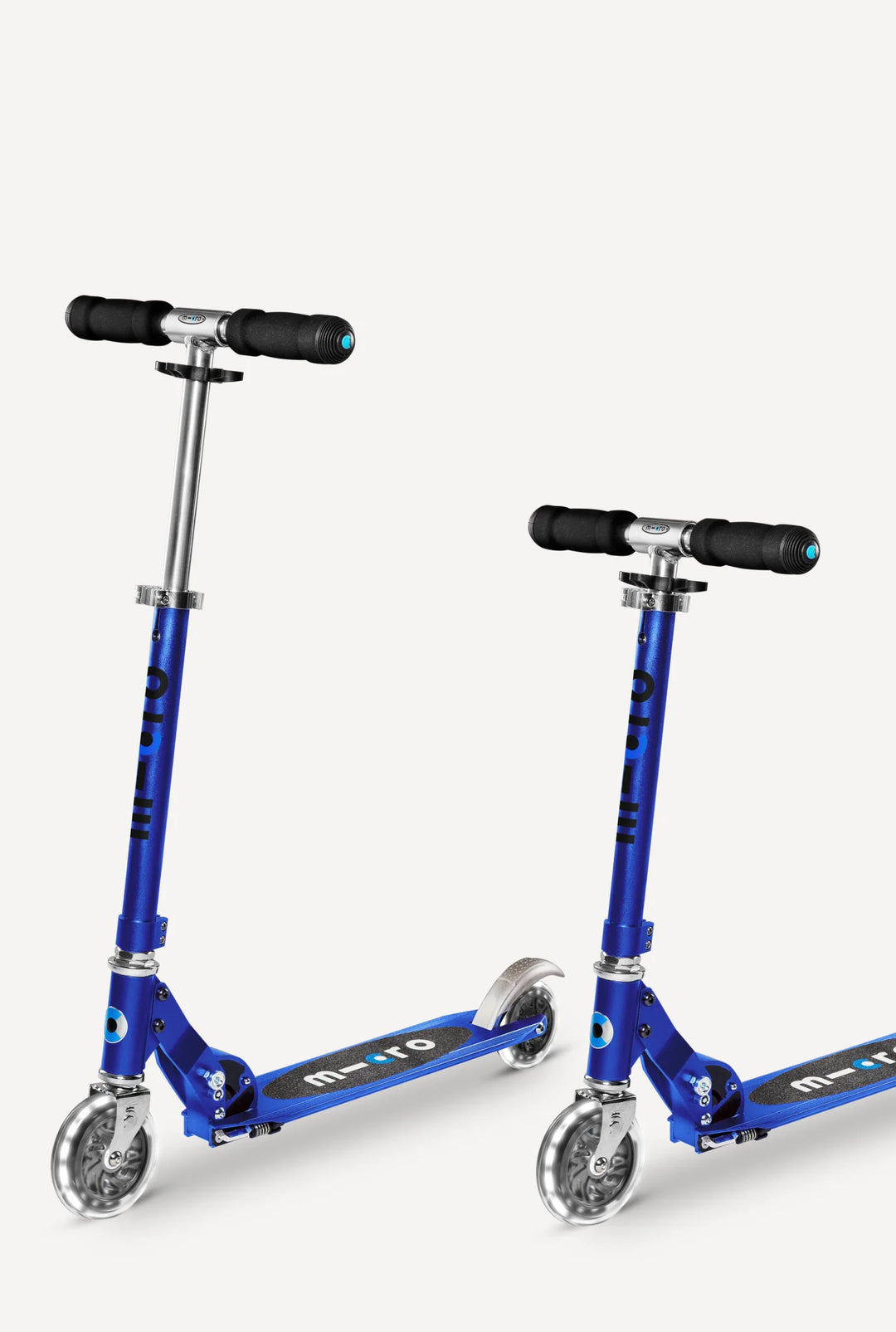Two blue scooter with black handles on a white background