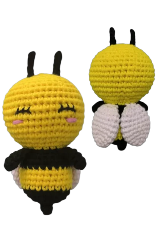Two crochet bee toys on a white background