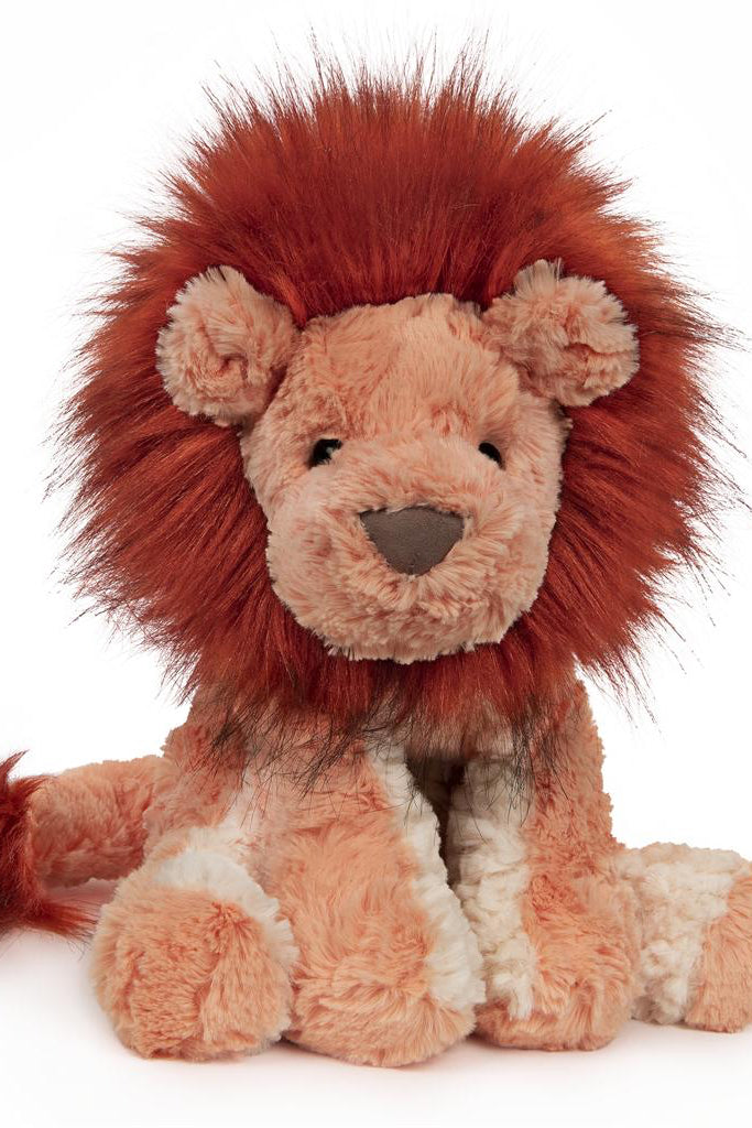 Photo of lion with orange mane stuffed animal 