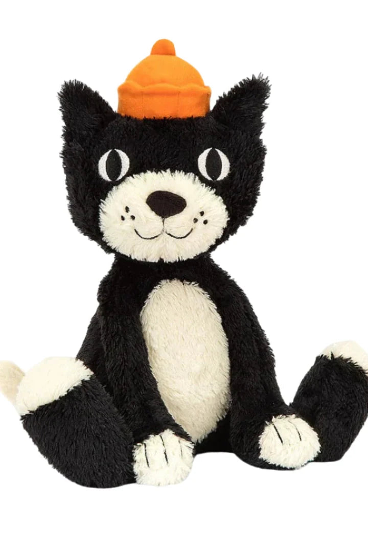 Black and white plush cat toy with an orange hat on a white background