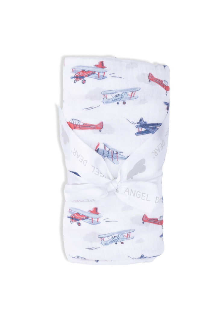 Baby blanket with airplane pattern on a white background