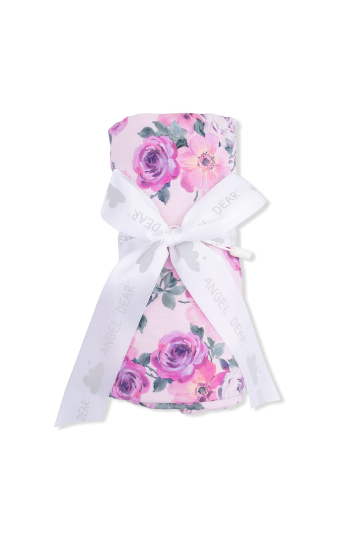 Floral baby blanket and hat set on a white background